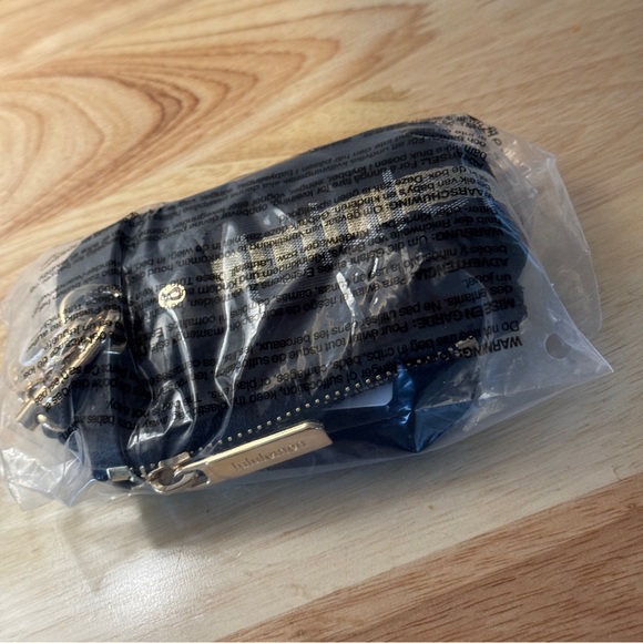 NWT Lululemon Dual Pouch Wristlet Black Gold Wordmark NWT - Picture 7 of 7